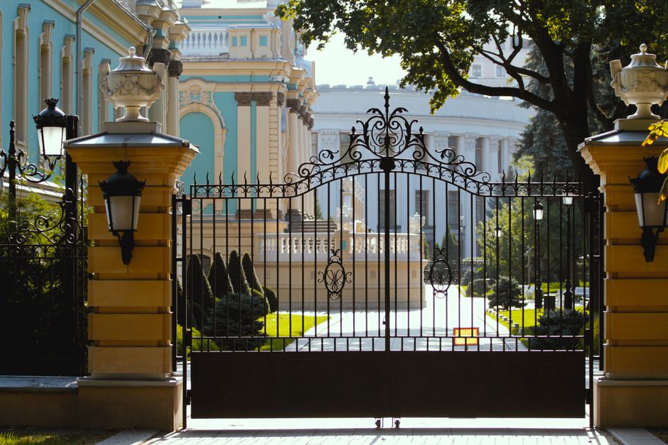 Close view of scrollwork on a wrought iron gate